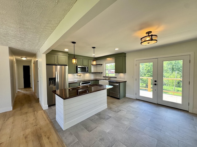 236 Walnut Ave, Somerset, KY 42503 - kitchen with stainless steel appliances, tasteful backsplash, baseboards, a center island, and green cabinetry