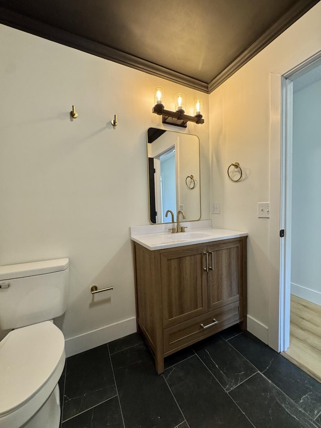 236 Walnut Ave, Somerset, KY 42503 - bathroom featuring baseboards, ornamental molding, vanity, and toilet