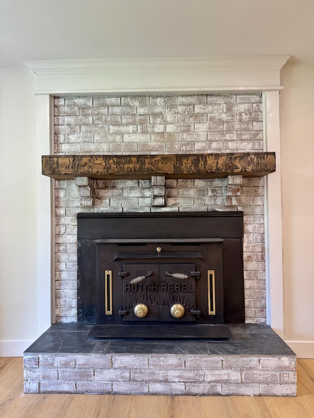 236 Walnut Ave, Somerset, KY 42503 - detailed view of a fireplace, wood finished floors, baseboards, and ornamental molding