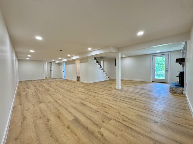 236 Walnut Ave, Somerset, KY 42503 - basement featuring recessed lighting, light wood-type flooring, baseboards, stairway, and a fireplace with raised hearth