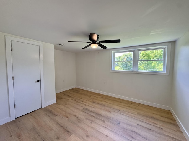 236 Walnut Ave, Somerset, KY 42503 - unfurnished bedroom featuring light wood-style flooring, baseboards, and a ceiling fan