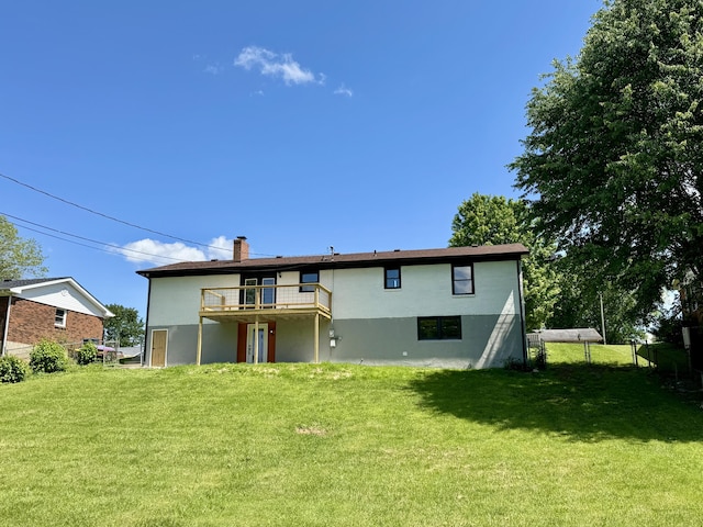 236 Walnut Ave, Somerset, KY 42503 - back of house featuring stucco siding, a lawn, a chimney, and a deck