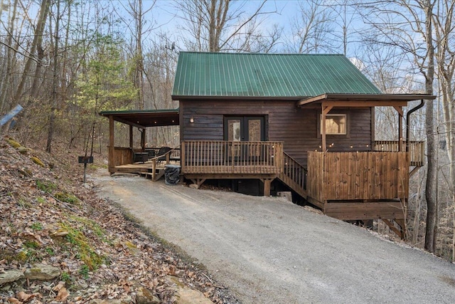 225 Platinum Dr, Slade, KY 40376 - rustic home featuring a wooden deck, french doors, and metal roof
