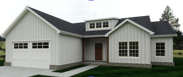 modern farmhouse featuring board and batten siding and a front yard