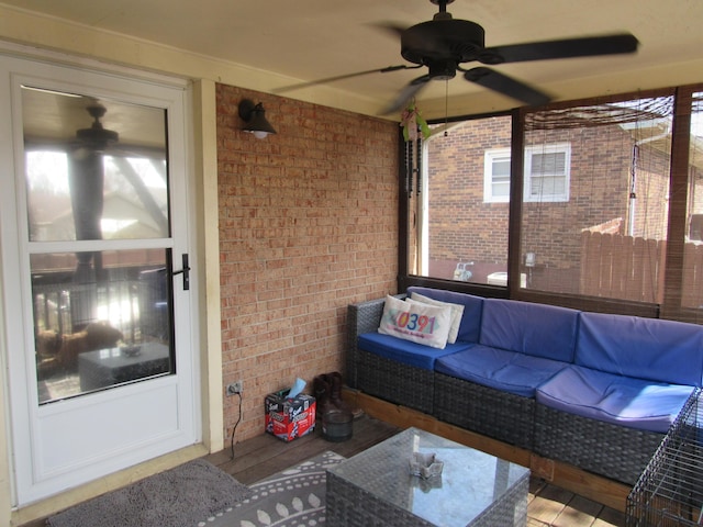 sunroom with a ceiling fan