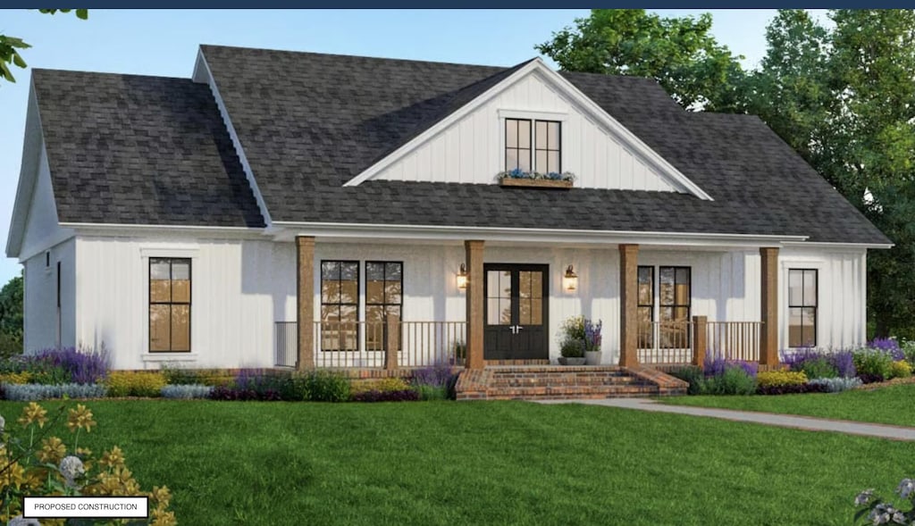 view of front of house with a porch, a front yard, and a shingled roof