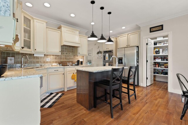 1841 Peter Cave Rd, Mckee, KY 40447 - kitchen with cream cabinets, a ceiling fan, decorative backsplash, dark wood-style floors, and ornamental molding
