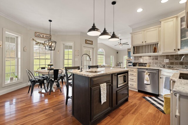 1841 Peter Cave Rd, Mckee, KY 40447 - kitchen featuring appliances with stainless steel finishes, a sink, a chandelier, light wood-style floors, and crown molding