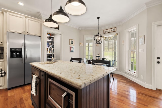 1841 Peter Cave Rd, Mckee, KY 40447 - kitchen featuring appliances with stainless steel finishes, a sink, a chandelier, light wood-style floors, and crown molding