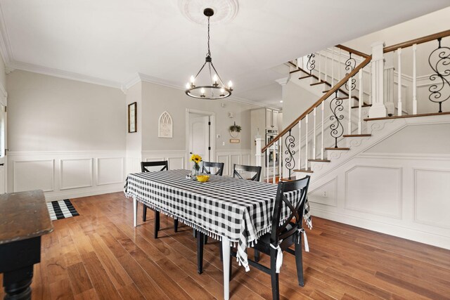 1841 Peter Cave Rd, Mckee, KY 40447 - dining space with a chandelier, wood finished floors, ornamental molding, a wainscoted wall, and a decorative wall