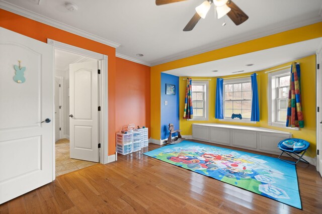 1841 Peter Cave Rd, Mckee, KY 40447 - playroom featuring light wood finished floors, ceiling fan, baseboards, and crown molding