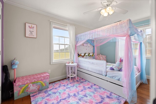 1841 Peter Cave Rd, Mckee, KY 40447 - bedroom with crown molding, wood finished floors, a ceiling fan, and a chandelier