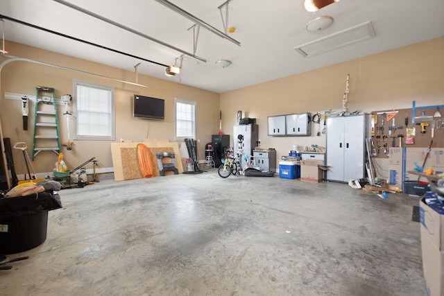 1841 Peter Cave Rd, Mckee, KY 40447 - garage featuring a garage door opener