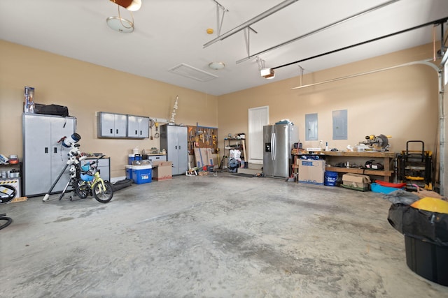 1841 Peter Cave Rd, Mckee, KY 40447 - garage with stainless steel refrigerator with ice dispenser, a workshop area, a garage door opener, and electric panel