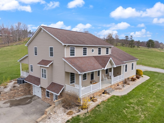 1841 Peter Cave Rd, Mckee, KY 40447 - view of front of property featuring covered porch, an attached garage, driveway, a shingled roof, and a front lawn
