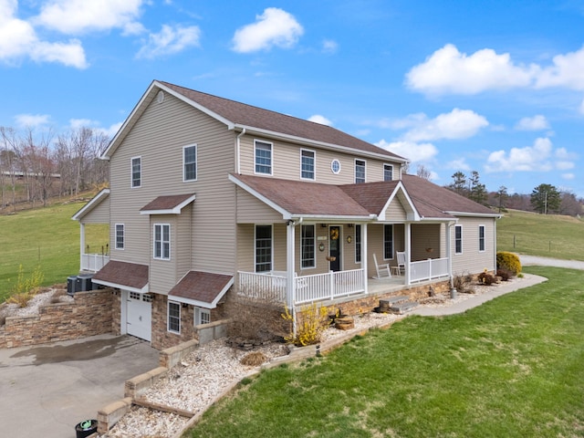 1841 Peter Cave Rd, Mckee, KY 40447 - view of front of property featuring covered porch, an attached garage, driveway, a shingled roof, and a front lawn