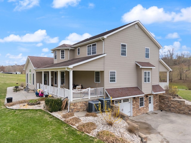 1841 Peter Cave Rd, Mckee, KY 40447 - back of house with covered porch and a lawn