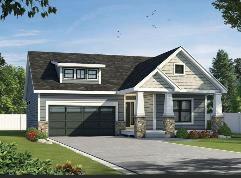 craftsman inspired home with stone siding, driveway, a front yard, and fence