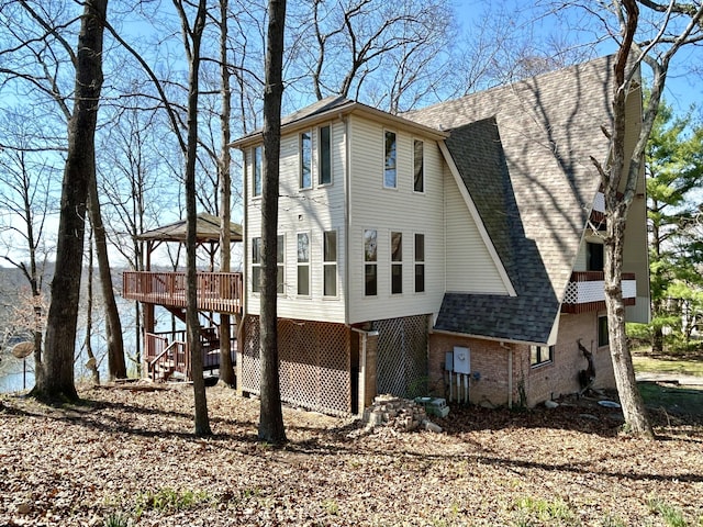 3101 Simpson Dr, Somerset, KY 42503 - view of property exterior featuring stairway, a wooden deck, a shingled roof, a gazebo, and brick siding