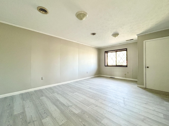 3101 Simpson Dr, Somerset, KY 42503 - unfurnished room featuring visible vents, wood finished floors, a textured ceiling, and ornamental molding