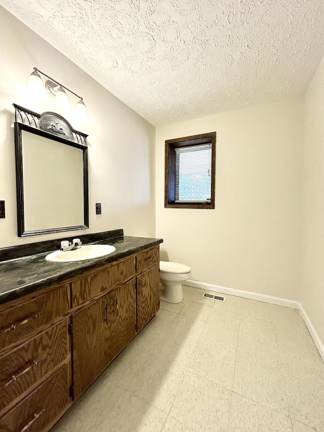 3101 Simpson Dr, Somerset, KY 42503 - bathroom with visible vents, toilet, vanity, and baseboards