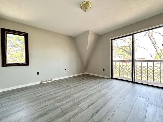 3101 Simpson Dr, Somerset, KY 42503 - unfurnished room featuring plenty of natural light, baseboards, visible vents, and wood finished floors