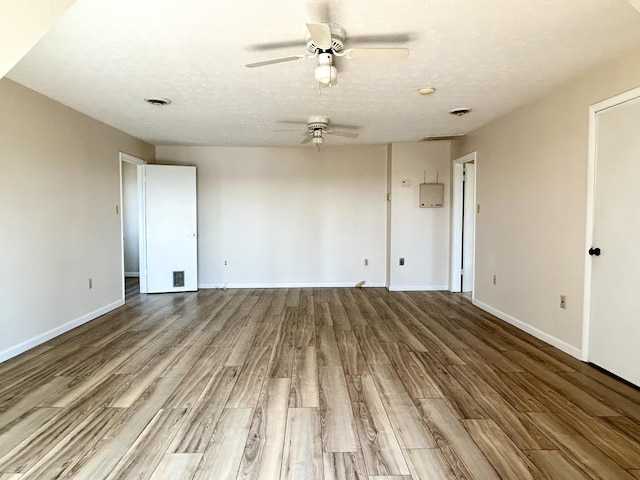 3101 Simpson Dr, Somerset, KY 42503 - empty room featuring baseboards, a textured ceiling, ceiling fan, and wood finished floors