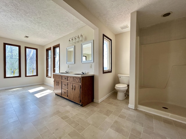 3101 Simpson Dr, Somerset, KY 42503 - bathroom with visible vents, baseboards, toilet, double vanity, and a shower