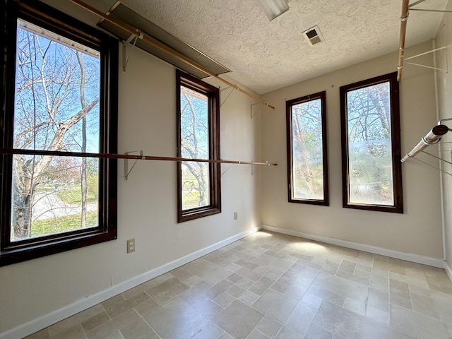 3101 Simpson Dr, Somerset, KY 42503 - spare room with plenty of natural light, a textured ceiling, and baseboards