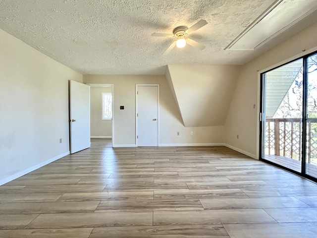 3101 Simpson Dr, Somerset, KY 42503 - bonus room with a textured ceiling, light wood finished floors, baseboards, attic access, and ceiling fan