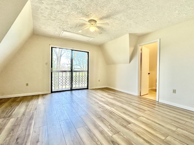 3101 Simpson Dr, Somerset, KY 42503 - additional living space with baseboards, a textured ceiling, wood finished floors, and vaulted ceiling