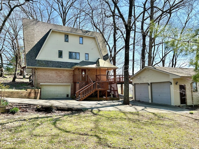 3101 Simpson Dr, Somerset, KY 42503 - view of front of house with roof with shingles, covered porch, stairs, an outdoor structure, and brick siding