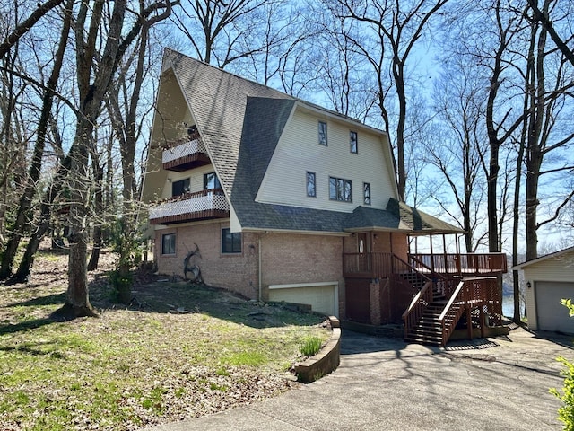 3101 Simpson Dr, Somerset, KY 42503 - view of front of home featuring stairway, a shingled roof, an outdoor structure, a garage, and brick siding