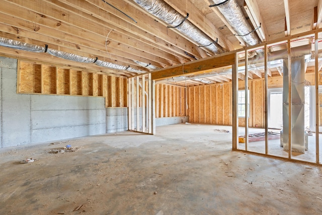 miscellaneous room featuring unfinished concrete flooring