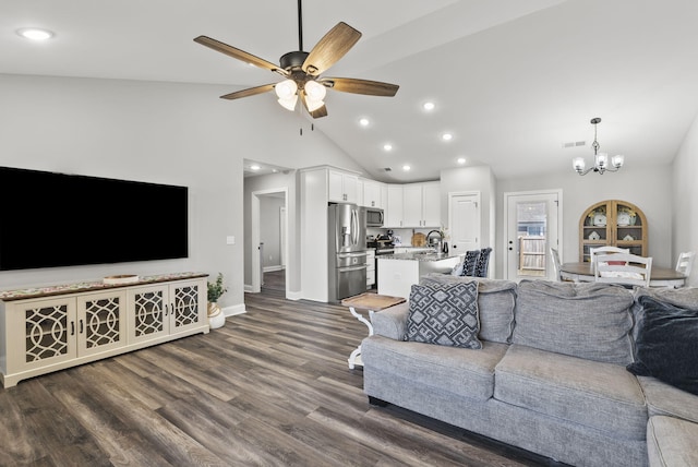 living area featuring visible vents, baseboards, dark wood finished floors, recessed lighting, and ceiling fan with notable chandelier