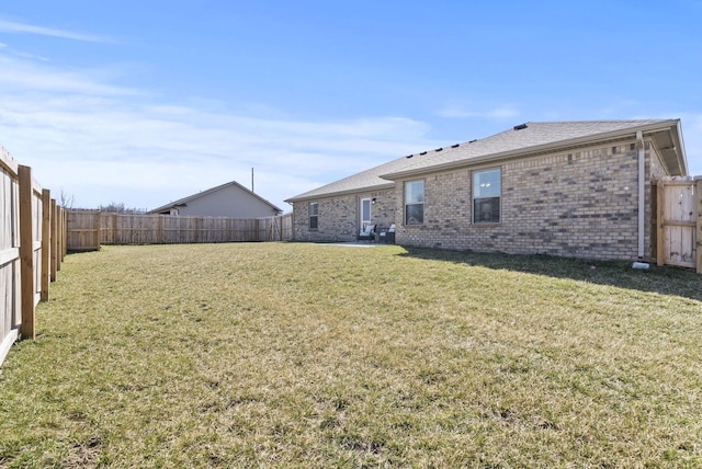 view of yard with a fenced backyard