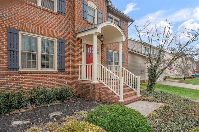 entrance to property with brick siding