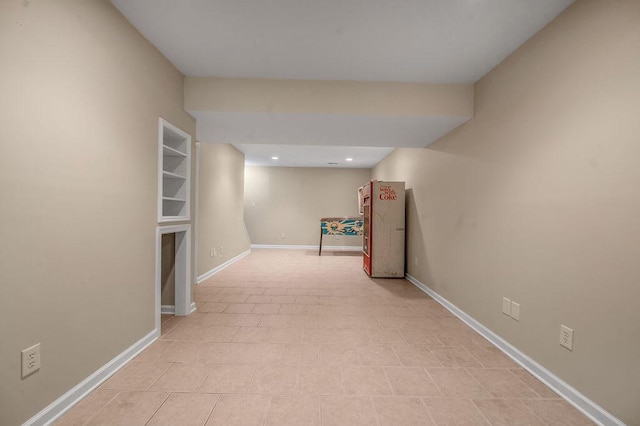 hallway featuring recessed lighting and baseboards