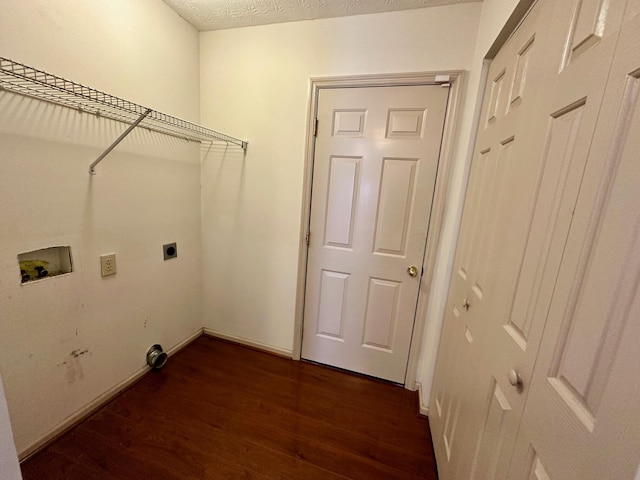 washroom featuring dark wood-type flooring, laundry area, hookup for a washing machine, electric dryer hookup, and a textured ceiling