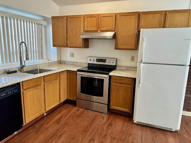 kitchen with stainless steel electric stove, black dishwasher, freestanding refrigerator, exhaust hood, and a sink