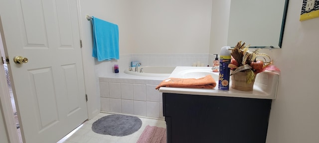 bathroom featuring vanity and a bath