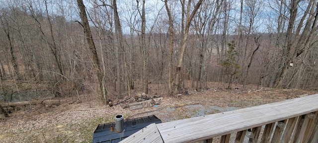 view of yard featuring a wooded view