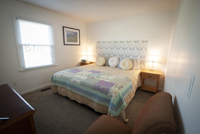 bedroom featuring visible vents, baseboards, and carpet flooring