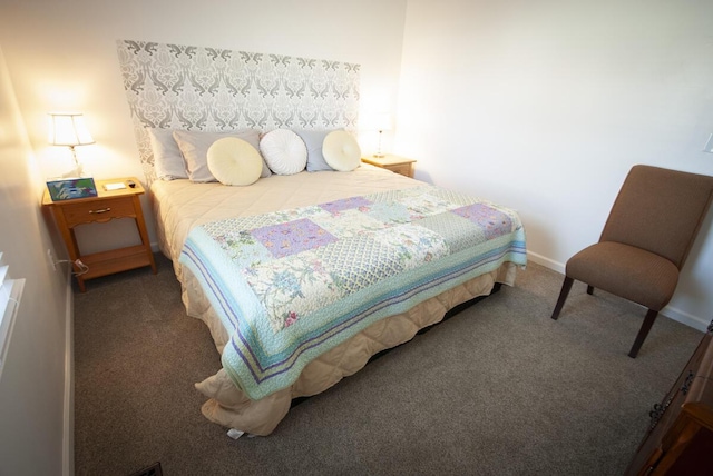 carpeted bedroom featuring baseboards