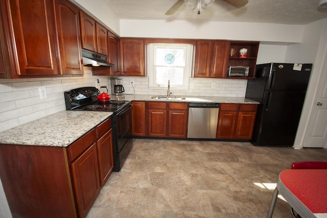 kitchen featuring a sink, light stone counters, black appliances, and under cabinet range hood