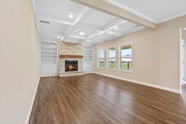 unfurnished living room with baseboards, beamed ceiling, a fireplace, coffered ceiling, and dark wood-style flooring