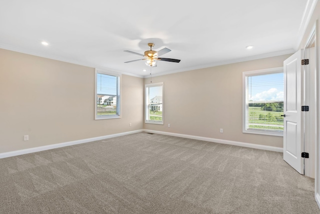 unfurnished room featuring baseboards, a ceiling fan, and crown molding