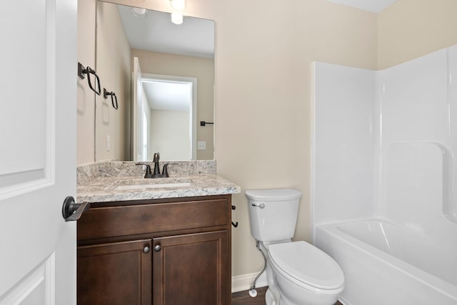 bathroom featuring toilet and vanity