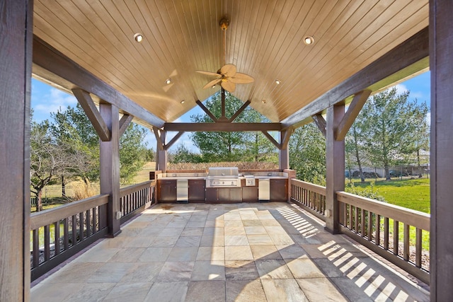 view of patio / terrace with a gazebo, area for grilling, and ceiling fan