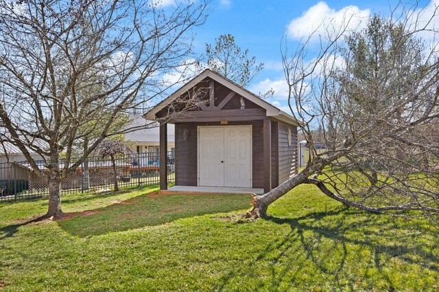 view of shed featuring fence